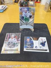 MaxSold Auction: Daniel Sedin Kesler Tanev Rookie Panini 2010-11 Vancouver Canucks Jersey Cards (3) - Maple Ridge (British Columbia, Canada) PARTNER MANAGED Estate Sale Online Auction - Blanshard Street