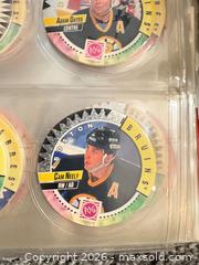 MaxSold Auction: Large Binder of 500+ NHL Hockey Pogs / Tazos with Slammer Discs (PGG, mixed teams) - Maple Ridge (British Columbia, Canada) PARTNER MANAGED Estate Sale Online Auction - Blanshard Street