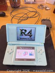 MaxSold Auction: Nintendo DS Lite Aqua/Teal Handheld Console with R4 - Maple Ridge (British Columbia, Canada) PARTNER MANAGED Estate Sale Online Auction - Blanshard Street