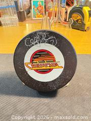 MaxSold Auction: Vancouver Canucks Signed NHL Official Trench Rubber Hockey Puck - Maple Ridge (British Columbia, Canada) PARTNER MANAGED Estate Sale Online Auction - Blanshard Street