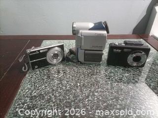 MaxSold Auction: Lot of 3 Olympus & Vivitar Cameras and Camcorder, Silver/Black/Gray no cords untested  - Township Of Brock (Ontario, Canada) SELLER MANAGED Downsizing Online Auction - Beechwood Avenue