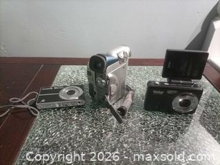 MaxSold Auction: Lot of 3 Olympus & Vivitar Cameras and Camcorder, Silver/Black/Gray no cords untested  - Township Of Brock (Ontario, Canada) SELLER MANAGED Downsizing Online Auction - Beechwood Avenue