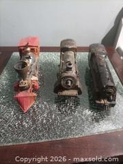 MaxSold Auction: Lot of Three Toy Train Locomotives - Tin, Die-cast & Plastic - Township Of Brock (Ontario, Canada) SELLER MANAGED Downsizing Online Auction - Beechwood Avenue