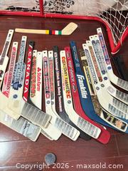 MaxSold Auction: T60 Mini hockey sticks and net  - Toronto (Ontario, Canada) SELLER MANAGED Downsizing Online Auction -  The Kingsway