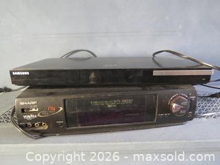 MaxSold Auction: Samsung Blu-ray/DVD Player and Sharp VCR/VHS Player, Black - Toronto (Ontario, Canada) SELLER MANAGED Downsizing Online Auction - St Edmunds Drive