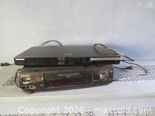 MaxSold Auction: Samsung Blu-ray/DVD Player and Sharp VCR/VHS Player, Black - Toronto (Ontario, Canada) SELLER MANAGED Downsizing Online Auction - St Edmunds Drive
