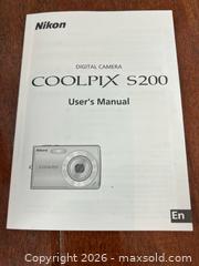 MaxSold Auction: Nikon Coolpix Camera and Tripod - Los Angeles (California, USA) PARTNER MANAGED Estate Sale Online Auction - Shoup Avenue (CONDO)