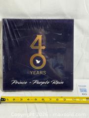 MaxSold Auction: Prince & Purple Rain Book With Sleeve LIKE NEW  - Ottawa (Ontario, Canada) SELLER MANAGED Downsizing Online Auction - Prince Albert Street