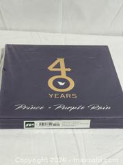 MaxSold Auction: Prince & Purple Rain Book With Sleeve LIKE NEW  - Ottawa (Ontario, Canada) SELLER MANAGED Downsizing Online Auction - Prince Albert Street