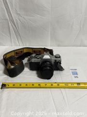 MaxSold Auction: Vintage Canon AE1 135 mm SLR Film Camera Photograph  - Ottawa (Ontario, Canada) SELLER MANAGED Downsizing Online Auction - Prince Albert Street