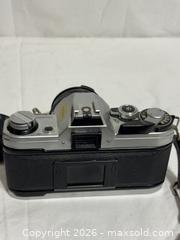 MaxSold Auction: Vintage Canon AE1 135 mm SLR Film Camera Photograph  - Ottawa (Ontario, Canada) SELLER MANAGED Downsizing Online Auction - Prince Albert Street
