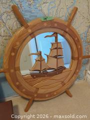 MaxSold Auction: Nautical Map & World Atlas Lot with Wooden Ship Wheel - Saanich (British Columbia, Canada) PARTNER MANAGED Moving Online Auction - Marsett Place (CONDO)