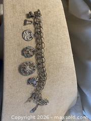 MaxSold Auction: Vintage 60-70s Sterling Silver 8 Charm Bracelet with Multicolor Stones - Toronto (Ontario, Canada) SELLER MANAGED Downsizing Online Auction - O'connor Drive (CONDO)