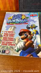 MaxSold Auction: Nintendo Super Mario Sunshine Gaming Guide and More - Hamilton (Ontario, Canada) SELLER MANAGED Estate Sale Online Auction - Gertrude Street