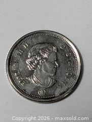 MaxSold Auction: 10 cent Coin of Canada Colorized Bluenose  - South Frontenac (Ontario, Canada) SELLER MANAGED Downsizing Online Auction - Battersea Road
