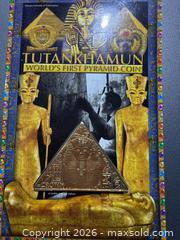 MaxSold Auction: Triangular 24ct Gold Plated Commemorative 1 Crown — Pobjoy Mint - Orange (Texas, USA) SELLER MANAGED Estate Sale Online Auction - Camelot Street