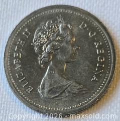 MaxSold Auction: 1977 Canada 1 Dollar Coin, Queen Elizabeth II Portrait - New Westminster (British Columbia, Canada) SELLER MANAGED Reseller Online Auction - Canfor Avenue