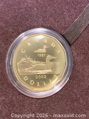 MaxSold Auction: 2002 22K Gold-Plated Loon Dollar Limited Edition (1/25,000) - Part of 2002 Olympic Games releases - New Westminster (British Columbia, Canada) SELLER MANAGED Reseller Online Auction - Canfor Avenue