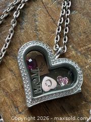 MaxSold Auction: A floating charm locket necklace - New Westminster (British Columbia, Canada) SELLER MANAGED Reseller Online Auction - Canfor Avenue