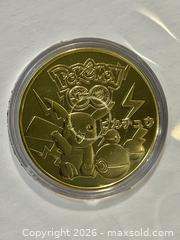 MaxSold Auction: Pokémon GO Pikachu 1996 Gold-Colored Collectible Coin - New Westminster (British Columbia, Canada) SELLER MANAGED Reseller Online Auction - Canfor Avenue