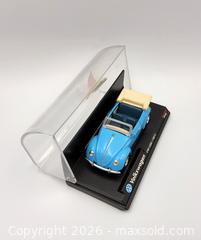 MaxSold Auction: 1997 New Ray 1951 VOLKSWAGEN VW1200 Diecast Car 1:43 Scale - Kingston (Ontario, Canada) SELLER MANAGED Downsizing Online Auction - Heron Court.