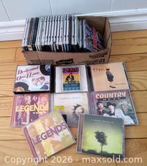 MaxSold Auction: Metal CD Rack Stand & Assorted Music CDs - Kingston (Ontario, Canada) SELLER MANAGED Downsizing Online Auction - Heron Court.