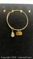 MaxSold Auction: Stamped Gold Tone Bangle w/charms  - Toronto (Ontario, Canada) SELLER MANAGED Estate Sale Online Auction - Saunders Road