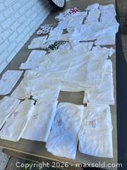 MaxSold Auction: Huge lot Hanes white T-shirts - Cocoa (Florida, USA) SELLER MANAGED Estate Sale Online Auction - Broadcast Court.