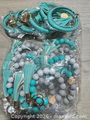 MaxSold Auction: New Keychains and Misc Jewelry  - Cocoa (Florida, USA) SELLER MANAGED Estate Sale Online Auction - Broadcast Court.