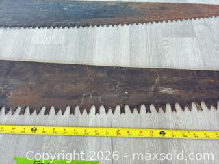 MaxSold Auction: Pair of antique/vintage lumberman crosscut hand saws - Cocoa (Florida, USA) SELLER MANAGED Estate Sale Online Auction - Broadcast Court.
