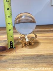 MaxSold Auction: Clear Crystal Display Orb with Gold Elephant Tripod Stand - Las Vegas (Nevada, USA) PARTNER MANAGED Estate Sale Online Auction - Bright Sun Court