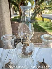 MaxSold Auction: Lot of 3 Clear Glass Oil Lamps with Brass Burners - Las Vegas (Nevada, USA) PARTNER MANAGED Estate Sale Online Auction - Bright Sun Court