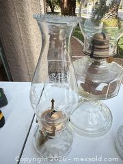 MaxSold Auction: Lot of 3 Clear Glass Oil Lamps with Brass Burners - Las Vegas (Nevada, USA) PARTNER MANAGED Estate Sale Online Auction - Bright Sun Court