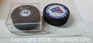 MaxSold Auction: (2) NHL NY RANGERS HOCKEY PUCKS - COLLECTIBLES  - Rockaway (New Jersey, USA) SELLER MANAGED Downsizing Online Auction - Miami Trail
