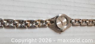 MaxSold Auction: VINTAGE SILVER TONE LADIES WRISTWATCH DELOIT  - Rockaway (New Jersey, USA) SELLER MANAGED Downsizing Online Auction - Miami Trail