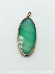 MaxSold Auction: Green Gem Stone Pendant  - Esquimalt (British Columbia, Canada) PARTNER MANAGED Reseller Online Auction -  Lampson Street