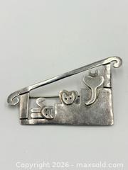 MaxSold Auction: Sterling Silver Cat Brooch by Anne Harvey - Esquimalt (British Columbia, Canada) PARTNER MANAGED Reseller Online Auction -  Lampson Street