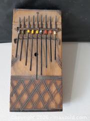 MaxSold Auction: VINTAGE KALIMBA CHECKERED HAND CARVED WOOD, THUMB PIANO INSTRUMENT - Ottawa (Ontario, Canada) SELLER MANAGED Downsizing Online Auction - Maxime Street