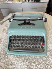 MaxSold Auction: Olivetti Underwood Aqua/Teal Portable Manual Typewriter - Toronto (Ontario, Canada) SELLER MANAGED Moving Online Auction - Saint Clair Avenue West