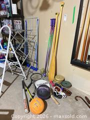 MaxSold Auction: Mixed Sports Equipment Lot with Balls, Bat, Rackets, Oars, Weights B - Niagara Falls (Ontario, Canada) Moving Online Auction - January Drive
