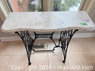 MaxSold Auction: Singer Sewing Machine Base Table: Marble Top and Cast Iron Base C - Niagara Falls (Ontario, Canada) Moving Online Auction - January Drive