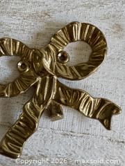 MaxSold Auction: Vintage Brass Bow Hook - Single Brass Wall Mounted Bow Hook - Kingston (Ontario, Canada) SELLER MANAGED Downsizing Online Auction - Bishop Street