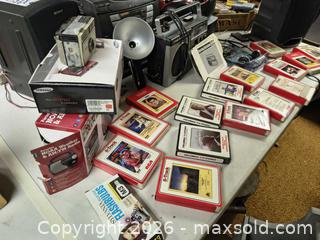 MaxSold Auction: Mixed Vintage Audio & Camera Lot — 8-Track, Cassette, CD, Kodak, Sony, Bose A - Kingston (Massachusetts, USA) PARTNER MANAGED Estate Sale Online Auction - Grove Street