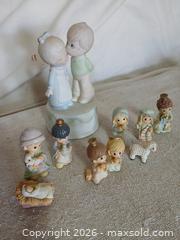 MaxSold Auction: Precious Moments "Sealed with A Kiss" Wedding Cake Topper – Bisque Porcelain and Precious Moments Nativity collection. - Sun City (Arizona, USA) SELLER MANAGED Reseller Online Auction - West Forrester Drive