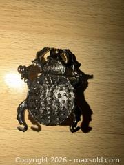 MaxSold Auction: 2” black decorative brooch designed to look like a scarab beetle w orange rhinestones  - Warwick Township (Pennsylvania, USA) SELLER MANAGED Estate Sale Online Auction - Crocker Lane