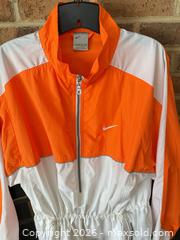 MaxSold Auction: RARE VINTAGE NIKE LADIES XL WHITE & ORANGE LONG WINDBREAKER WITH CINCH   - Warwick Township (Pennsylvania, USA) SELLER MANAGED Estate Sale Online Auction - Crocker Lane