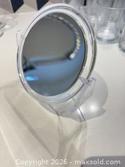 MaxSold Auction: Clear Small Double-Sided Wall-Mount Makeup Mirror - Toronto (Ontario, Canada) SELLER MANAGED Downsizing Online Auction - Poplar Plains Road