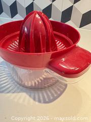 MaxSold Auction: Red/Clear Plastic Manual Citrus Juicer with Measuring Cup - Toronto (Ontario, Canada) SELLER MANAGED Downsizing Online Auction - Poplar Plains Road