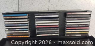 MaxSold Auction: CD Storage Rack with Large Mixed Music CD Collection – Pop, Rock & Soundtracks - Toronto (Ontario, Canada) SELLER MANAGED Downsizing Online Auction - Bridgeland (STORAGE)