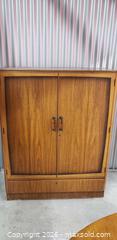 MaxSold Auction: Mid-Century Style Wood Storage Cabinet with Interior Shelving – 54”H - Toronto (Ontario, Canada) SELLER MANAGED Downsizing Online Auction - Bridgeland (STORAGE)